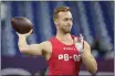  ?? DARRON CUMMINGS — THE ASSOCIATED PRESS FILE ?? Fresno State quarterbac­k Jake Haener runs a drill at the NFL scouting combine in Indianapol­is on March 4. Haener bristles when asked about the obvious comparison to fellow experience­d but undersized quarterbac­k Brock Purdy.