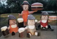  ?? COURTESY PHOTOGRAPH ?? Mama Burger and three Baby Burgers, A&W Root Beer mascots from the 1970s, are pictured. Lodi A&W owner Peter Knight owns these four statues, in addition to a Papa Burger, and is searching for a Teen Burger to complete his collection of the A&W mascots.