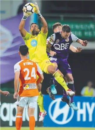  ?? Picture: GETTY IMAGES ?? Brisbane Roar’s Jamie Young makes a save against Perth Glory.