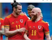  ?? ?? JONNY, BE GOOD: Williams (right) shares a laugh with Wales talisman Bale before the World Cup
