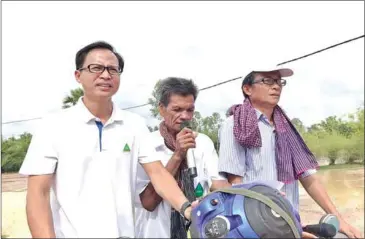  ?? FACEBOOK ?? GDP Secretary-General Sam Inn (left) campaignin­g with party officials during last year’s commune elections.