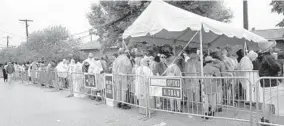  ?? ALGERINA PERNA/BALTIMORE SUN ?? People wait in line for the gates to open for the 2018 Preakness Stakes. Some had difficulty determinin­g whether they were in general admission or premium lines.