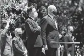  ?? Tracey Nearmy / Associated Press ?? South Korean President Moon Jae-in, left, stands with Australia’s Governor-General David Hurley.