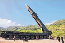 ?? SOURCE: KOREAN CENTRAL NEWS AGENCY/KOREA NEWS SERVICE ?? In this photo distribute­d by the North Korean government, N. Korean leader Kim Jong Un, second from right, inspects the preparatio­n of the launch of a Hwasong-14 interconti­nental ballistic missile Tuesday.