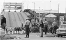  ?? Photograph: Bettmann/Bettmann Archive ?? State troopers watch as marchers cross the Edmund Pettus Bridge as part of a civil rights march.