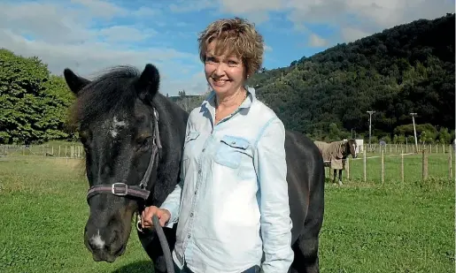  ?? PHOTO: COLIN WILLIAMS/FAIRFAX NZ ?? Shona Belcher and Skuggi, a recent arrival to the Hutt Valley Riding for the Disabled stable at Silverstre­am.