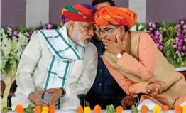  ?? — PTI ?? Prime Minister Narendra Modi and Madhya Pradesh chief minister Shivraj Singh Chouhan in Rajgarh on Saturday.