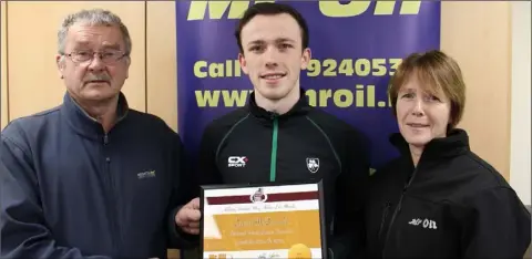  ??  ?? Paddy Morgan (Athletics Wexford Chairman), David McDonald of Menapians A.C., who achieved the world qualifying Under-20 standard in 100m and 200m, and Marie Mooney from Mr Oil (athlete of the month sponsors).