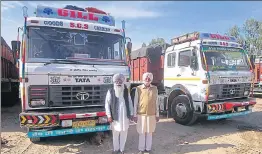  ?? HT PHOTOS ?? Two residents of Mahian Wala Kalan village with their trucks; and (right) the ‘mazar’ of Bhagat Duni Chand who blessed the village residents with success in the transport business.