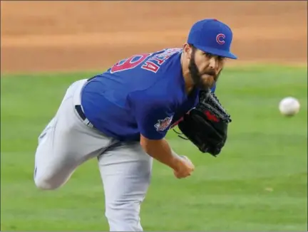  ?? MARK J. TERRILL — THE ASSOCIATED PRESS ?? Chicago Cubs starting pitcher Jake Arrieta throws to the plate during the second inning of a baseball game against the Los Angeles Dodgers, Sunday in Los Angeles.