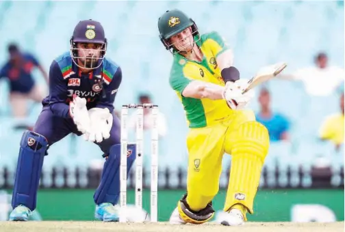  ?? Agence France-presse ?? ↑
Australia’s Steve Smith hits a six against India during their second ODI match at the Sydney Cricket Ground on Sunday.