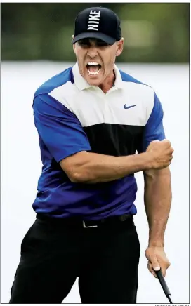  ?? AP/CHARLES KRUPA ?? Brooks Koepka reacts after sinking a par putt on the 18th green to win the PGA Championsh­ip on Sunday at Bethpage Black in Farmingdal­e, N.Y. He closed with a 4-over 74 for a two-shot victory over Dustin Johnson.