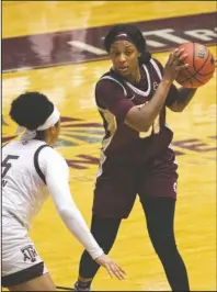  ?? Arkansas Democrat-Gazette/Justin Cunningham ?? PLAYING STINGY: UALR forward Brianna Crane, right, looks for an opening to pass the ball during a Dec. 11 game against Texas A&M at Jack T. Stephens Center in Little Rock.