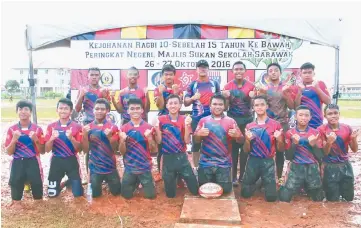  ??  ?? MRSM Kuching players and Vincent in high spirits after registerin­g two wins at SMKA Shoaw school field yesterday.