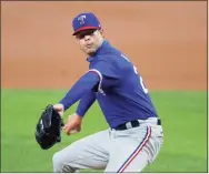  ?? Tony Gutierrez / Associated Press ?? Corey Kluber seen pitching for the Rangers in July. The New York Yankees reached a deal with Kluber worth $11 million for one year.