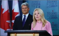  ?? CP PHOTO ?? Michelle Rempel, Shadow Minister for Immigratio­n, Refugees and Citizenshi­p, and Gerard Deltell, Shadow Minister for the Treasury Board, hold a press conference at the National Press Theatre in Ottawa on Wednesday.