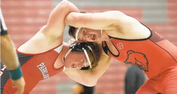  ?? DAVID GARRETT/SPECIAL TO THE MORNING CALL ?? Parkland’s Garrett Fitzgerald (left) and Boyertown’s Jacob Sanders battle in their in 220-pound match. Sanders won the bout 5-2.