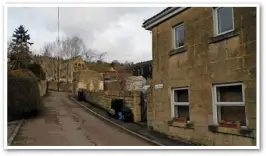  ??  ?? Mill Lane in Monkton Combe, which led down to Titfield station. Passengers are seen descending this hill. No. 1 Station Cottage is on the right. The station site is also to the right, and is now buried under tennis courts belonging to a school.