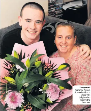  ??  ?? Deserved Suzanne Anton, pictured with son Brian, was delighted to receive the bouquet