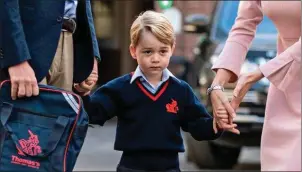  ??  ?? George on his way to his first day of school.