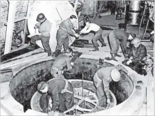  ?? EMILIO SEGRE VISUAL ARCHIVES VIA NEW YORK TIMES ?? A file photo shows workers dismantlin­g the German experiment­al nuclear pile at Haigerloch, southwest of Stuttgart, in April 1945. Scientists are working to determine whether three uranium cubes at an American lab were produced by the Nazi’s failed nuclear weapons program.