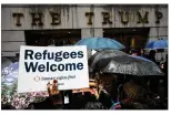  ?? DREW ANGERER / GETTY IMAGES ?? Protesters rally at the Trump Building on Wall Street during a protest against the Trump administra­tion’s proposed travel ban.