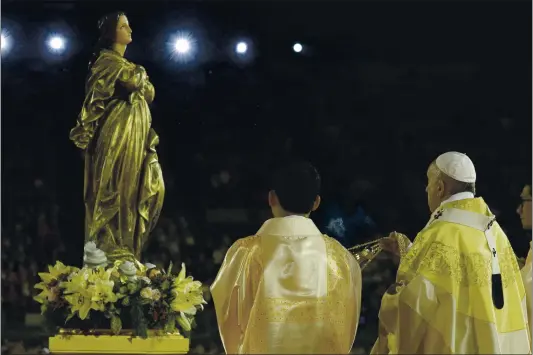  ?? GREGORIO BORGIA — THE ASSOCIATED PRESS ?? Pope Francis blesses a statue of the Mother Mary Nov. 21, 2019 as he celebrates Mass at the National Stadium, in Bangkok, Thailand. Pope Francis is giving his blessing to a new Vatican think tank that is seeking to prevent the Mafia and organized crime groups from exploiting the image of the Virgin Mary for their own illicit ends.