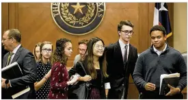  ?? RALPH BARRERA / AMERICAN-STATESMAN ?? High school students with March for Our Lives greet some Texas representa­tives as they wait to testify before a House committee Monday. The panel discussed potential gun law changes.