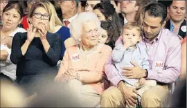  ?? David Goldman
Associated Press ?? JEB BUSH’S wife, Columba, left, his mother, Barbara, and his son George P. Bush, holding grandson Prescott, were on hand for the announceme­nt.