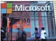  ?? JEWEL SAMAD, AFP/GETTY IMAGES ?? Microsoft shares surged 6% in afterhours trading to $60.74.