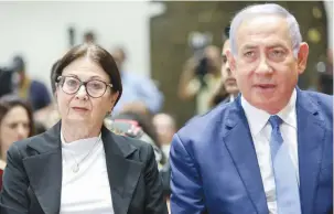  ?? (Noam Revkin Fenton/Flash90) ?? PRIME MINISTER Benjamin Netanyahu and Supreme Court President Esther Hayut attend a ceremony in Jerusalem, in 2019.