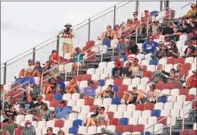  ?? CHRIS CARLSON — THE ASSOCIATED PRESS ?? Fans watch the race during a NASCAR Cup Series auto race Sept. 6in Darlington, S.C.