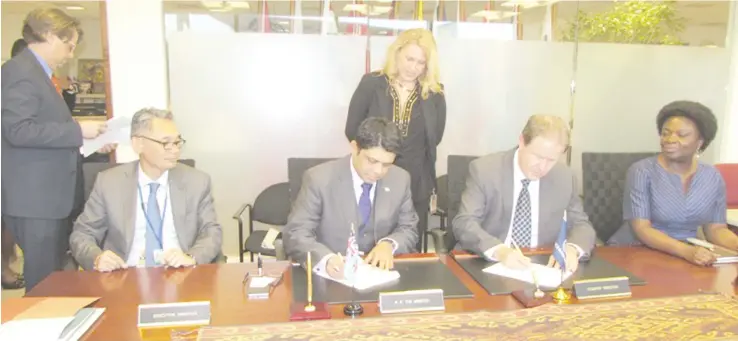  ?? Photo: DEPTFO News ?? Attorney-General and Minister for Finance, Aiyaz Sayed-Khaiyum (seated second from left), with World Bank officials signing the US$50 million (FJ$103.84m) loan facility.