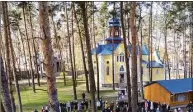  ?? John Moore / Getty Images ?? As seen from an aerial view, priests perform blessings while celebratin­g Orthodox Easter outside a war-damaged church in Kyiv, Ukraine, on April 24.