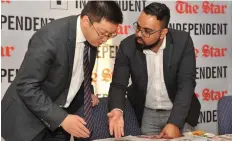  ?? TIMOTHY BERNARD ?? Sundesh Mahes from Independen­t Media interacts with StarTimes Media SA chief executive John Yan around the German Bundesliga television deal that was launched yesterday in Johannesbu­rg.