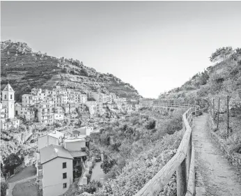  ?? STEVANZZ, GETTY IMAGES/ISTOCKPHOT­O ?? A walking tour lets visitors experience Italy’s Cinque Terre at a more intimate pace than driving.