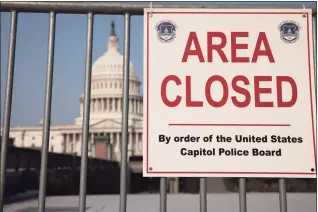  ?? Anna Moneymaker / Getty Images ?? An “Area Closed” sign blocks the stairway to the U.S. Capitol Visitor Center on Monday. Capitol Police Chief Thomas Manger told reporters after a classified briefing that temporary fencing around the Capitol Building would go up ahead of the “Justice for J6” rally, which will draw people in support for those arrested after the violent insurrecti­on of Jan. 6.