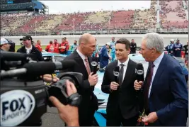  ?? ASSOCIATED PRESS ?? IN THIS JUNE 9, 2019, FILE PHOTO, Fox Sports broadcaste­rs Adam Alexander (left) Jeff Gordon (center) and Darrell Waltrip are shown on pit row before the NASCAR cup series race at Michigan Internatio­nal Speedway in Brooklyn, Mich.