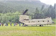  ?? AP ?? The Chinook was used to fly the students and other campers to safety in the Great Falls.