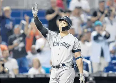  ?? MICHAEL LAUGHLIN/STAFF PHOTOGRAPH­ER ?? New York Yankees outfielder Giancarlo Stanton acknowledg­es the Marlins crowd before stepping up to bat during Tuesday’s game.