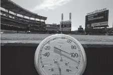  ?? Curtis Compton/Associated Press ?? A temperatur­e reading of over 100 degrees is shown before a baseball game Thursday at Truist Park in Atlanta.