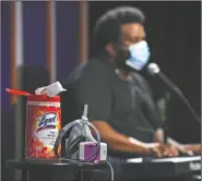  ??  ?? A container of Lysol disinfecta­nt wipes sits on a table onstage as Robinson performs.