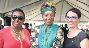  ??  ?? From left: Olivia Grange, minister of entertainm­ent, sport, culture and gender affairs; the multifacet­ed Barbara Blake-Hanna; and Kamina Johnson-Smith, minister of foreign affairs and foreign trade, pose for the camera during the floral tribute...
