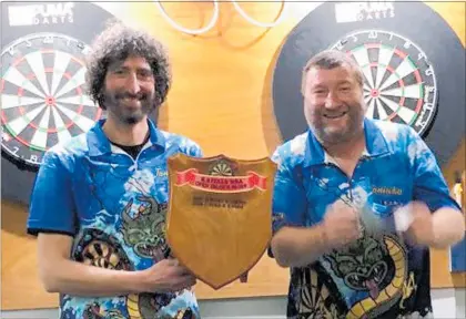  ??  ?? Frank Giovinazzo (left) and James Miller, who both hailed from the Whangarei-based Taniwha darts club, took out first place in the Far North RSA Open Drawn Pairs Darts Championsh­ip on Saturday.
