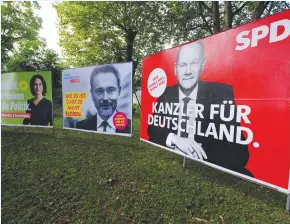  ?? (Wolfgang Rattay/Reuters) ?? ELECTION POSTERS in a park near Bonn last week.