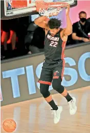  ?? AFP ?? Jimmy Butler of the Miami Heat dunks during their Game Three of the Eastern Conference Second Round match against the Milwaukee Bucks in NBA Playoffs at the Field House in Lake Buena Vista, Florida, on Friday. Miami won 115-100. —