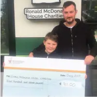  ??  ?? Kaydan Melvin and dad Nathan Melvin, with their cheque for the Ronald McDonald House
