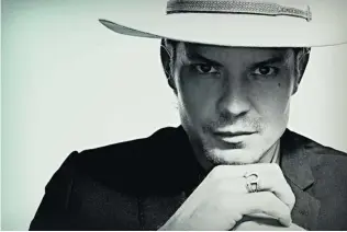  ?? JAMES MINCHIN/ FX ?? Timothy Olyphant plays Raylan Givens, a strong, silent hero who wears a cowboy hat, in Justified.
