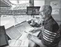  ?? CP PHOTO ?? Toronto Blue Jays broadcaste­r Jerry Howarth overlooks the field from his broadcast booth before the Toronto Blue Jays play against the Chicago White Sox in Toronto on June 17, 2017.