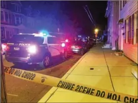  ?? EVAN BRANDT — DIGITAL FIRST MEDIA ?? A female shooting victim was found on the sidewalk on the north side of the 400 block of Chestnut Street on July 5 and a male shooting victim was found on the 300 block of Chestnut Street, where more police tape was set up.